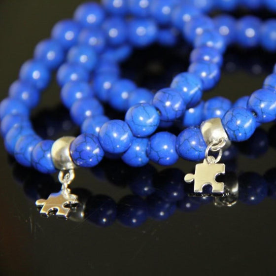 Hand-assembled by people with autism. Each bracelet has an autism charm.