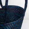 Traditional handwoven picnic basket made from sustainable materials. The basket has an intricate weaving pattern. The basket has sturdy handles for easy transport and is perfect for outdoor picnics, beach trips, or as a stylish storage solution at home.