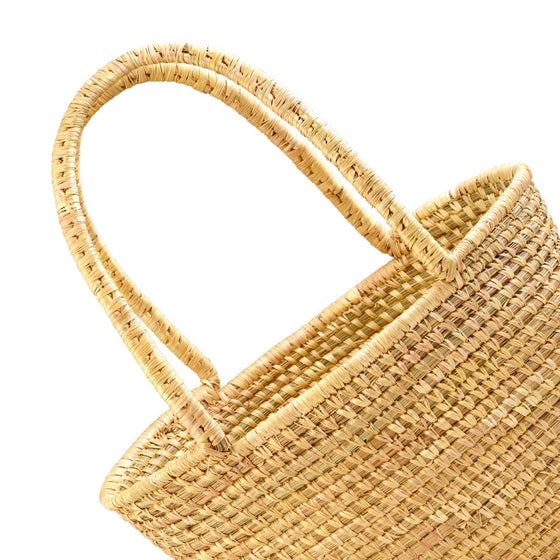 Handmade, handwoven rattan basket, made by women artisans.