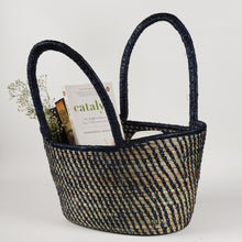  Traditional handwoven picnic basket made from sustainable materials. The basket has an intricate weaving pattern. The basket has sturdy handles for easy transport and is perfect for outdoor picnics, beach trips, or as a stylish storage solution at home.