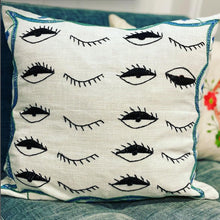  Hand-embroidered pillow cover with eye patterns. Meticulously crafted by refugee moms