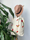 Cotton, Handmade, Purposeful tote bag. Sustainable and hand embroidered by refugee moms.