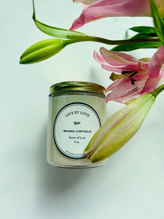 Scent of love candle. Hand poured in United States. Floral and earthy scent. 8 oz candle in a glass jar.